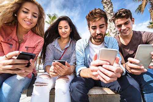 People looking at their smartphones