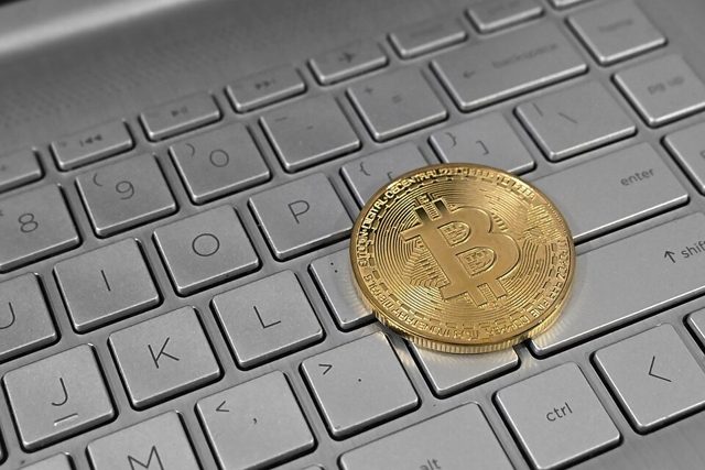 A Bitcoin coin on a laptop keyboard (stock image)