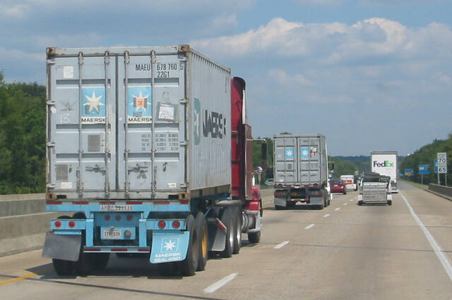 Container trucks on a highway