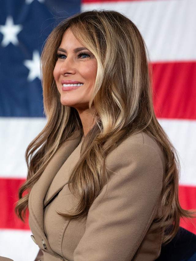 Melania Trump in front of a US flag