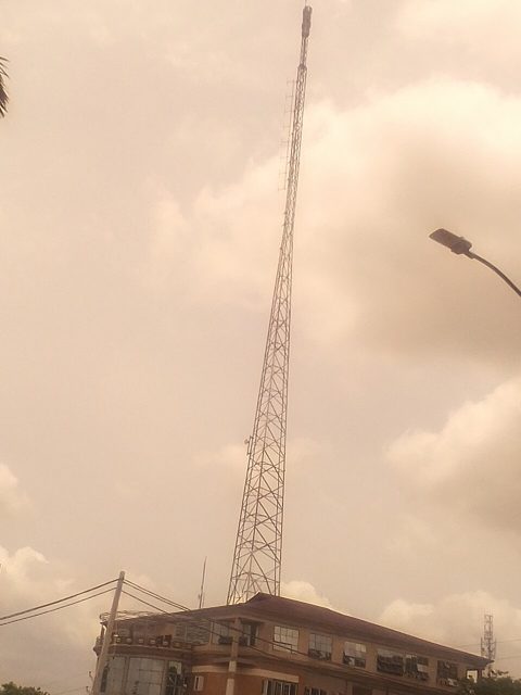 A telecom mast above a building in Nigeria