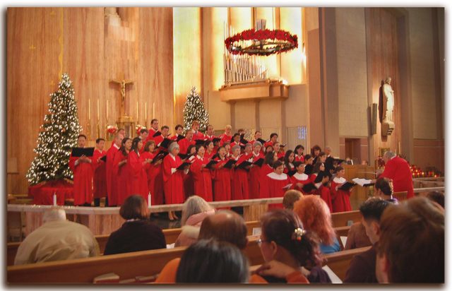 A church choir in red robes sings during a service (stock image)