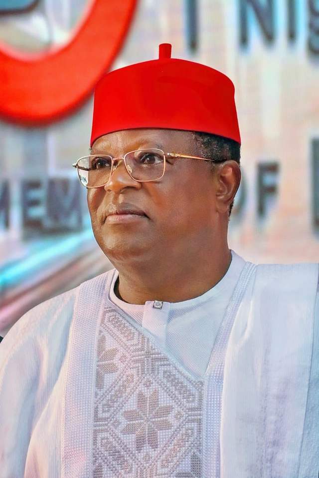 Dave Umahi in a red cap