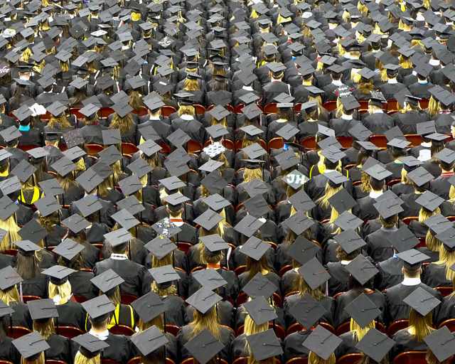 Graduates' mortarboard caps at a ceremony (stock image)